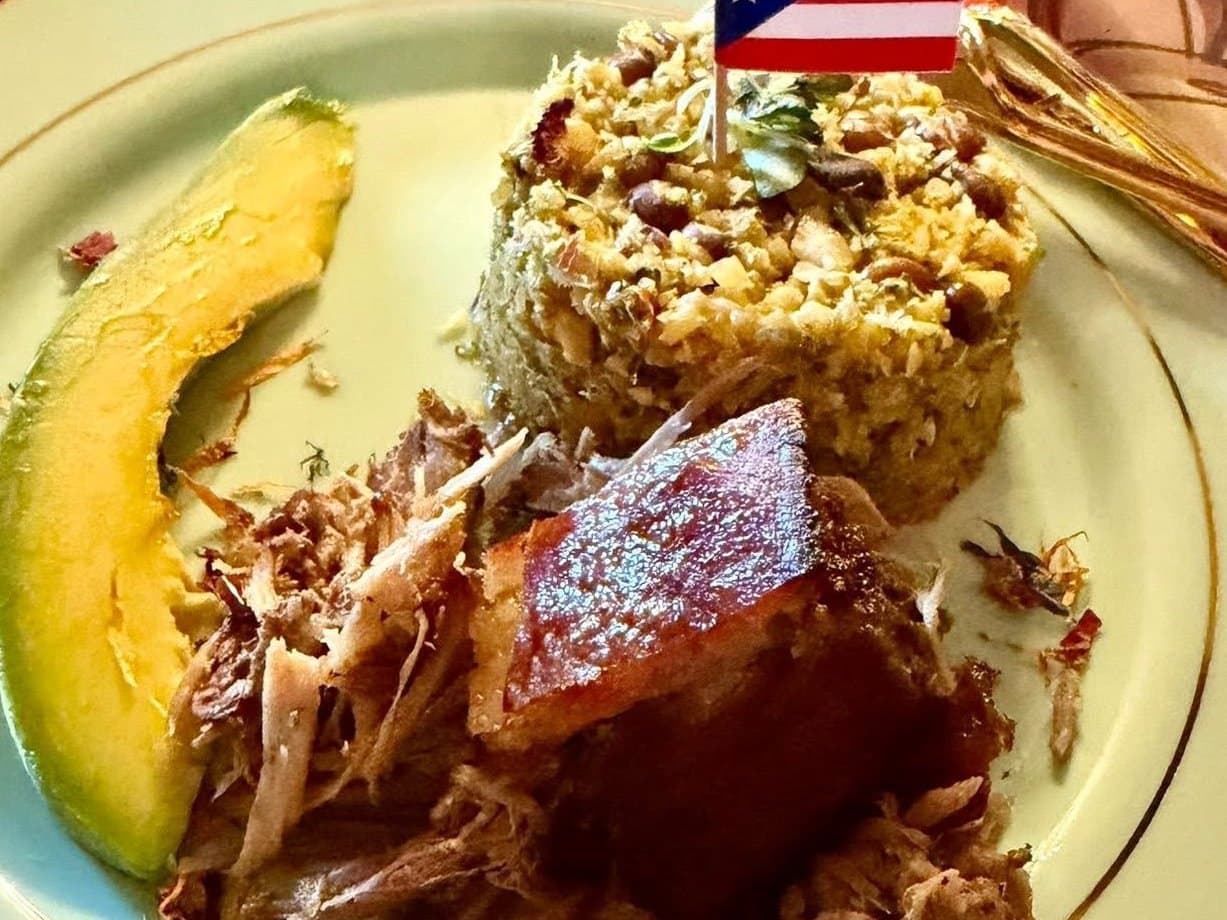Dinner plated by Al: pulled pork, seasoned rice with beans, and avocado